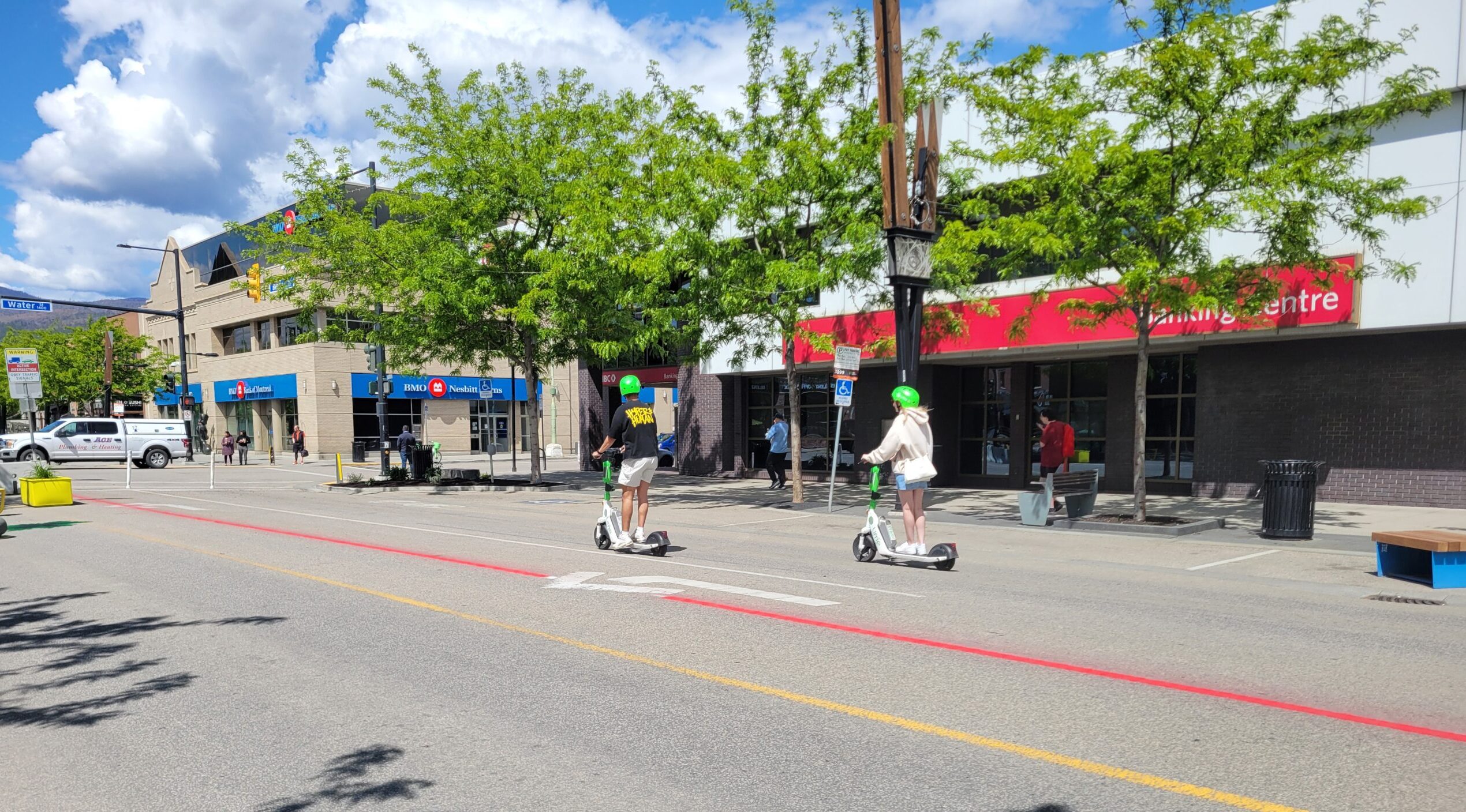 people riding electric scooters